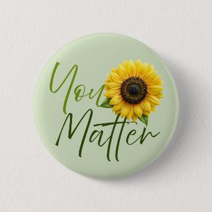 Matter med solros knapp