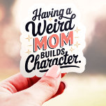 Med en Konstig Mamma Bygger tecknet Funny Vinyl Klistermärken<br><div class="desc">Den här konstiga och besläktade klistermärket är perfekt för alla som har ett mystiskt eller okonventionellt mamma! Med frasen "Att ha en Konstig Mamma Bygger tecken" är detta mönster en lätt hyllning till de mammor som anammar sina unika personligheter. Den här etiketten är tillverkad med en hållbar vinyl och är...</div>