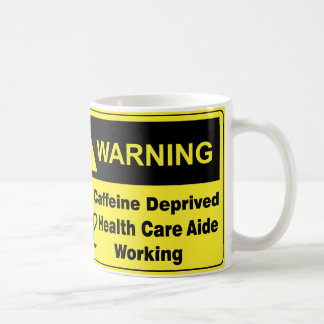 Medhjälpare för koffeinvarningssjukvård kaffemugg