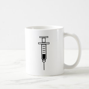 Medicinsk injektionsspruta kaffemugg