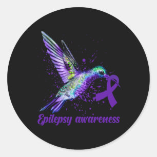Medvetenhet om hummingbird Lila Ribbon Epilepsy Må Runt Klistermärke