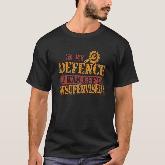 Mekanik i mitt försvar Lämnades oövervakad T Shirt (Framsida)