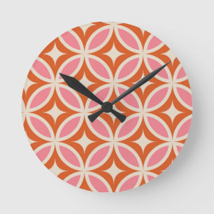 Mellandekorativt geometriskt mönster rosa orange rund klocka