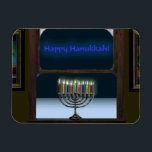 Menorah i fönstret magnet<br><div class="desc">En bild av en traditionell Chanukkah-menorah i ett fönster.  Menoran återspeglas i fönstret,  det finns frost på glaset och snö utanför.</div>