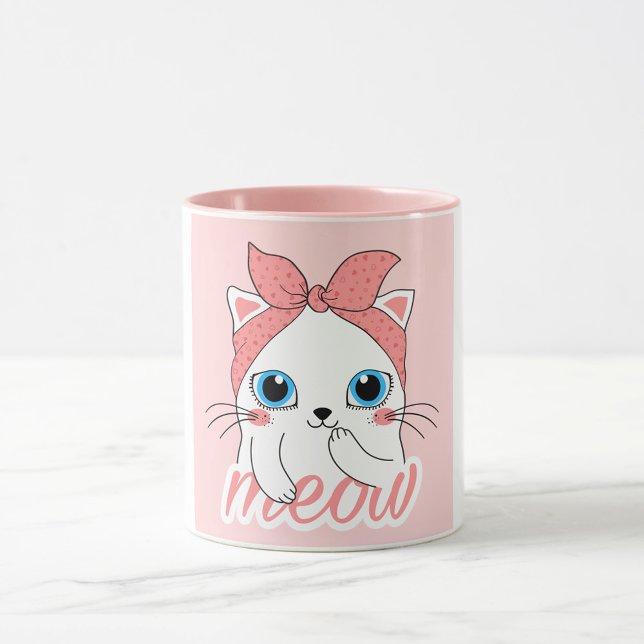 Meow Cat Mugg (A white mug with a pink interior and a pink exterior features a cartoon illustration of a white cat.)