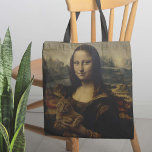 Meow Lisa Tygkasse<br><div class="desc">Meow Lisa Tote Bag - Har du undrat vad som är orsaken till det mystiska Mona Lisa leende? För det andra har vi svaret. Det här absoluta mästerverket i en väska har världens mest kända konstverk som "borstar av" och har lite kvalitetstid med kattunge. Oavsett om du är en kattälskare,...</div>
