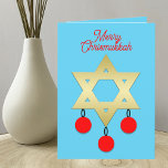 Merry Chrismukah Intertron Helgdag Card Helgkort<br><div class="desc">Detta Julhälsningar kort kombinerar två helgdagar jul och Hanukkah. Utformningen har David stjärna i blå bakgrund med tre röda julprydnader hängande från den. Ord,  "Merry Chrismukah",  visas längst upp. Detta är ett underbart sätt att fira två helgdagar i gång. Copyright Kathy Henis</div>