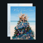 Merry Florida jul Tropical Beach och Träd Helg Vykort<br><div class="desc">Fira helgdagarna med detta vackra, tropiska julvykort. Utformningen är en foto av en fantastisk Julgran som visas på konstmuseet i Orlando under den årliga festivalen i Träd. Det vackra helgdag är kantinspirerat av kustinspirerade dekorationer som svält, miniatyrfisk, bete-färgad-ornament bollar i blått, grönt och elfenben, och en stor sjöjungfruar med grenar...</div>