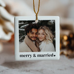 Merry & Married Heart Photo Julgransprydnad Keramik<br><div class="desc">This holiday ornament is designed for newlyweds celebrating their first married Christmas, blending modern simplicity with seasonal charm. It features a photo that you can upload to showcase your favorite moment together. The phrase "merry & married" in a bold typographical design is accompanied by a delicate heart next to it....</div>