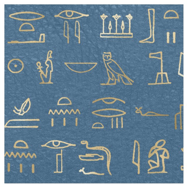 Metalliska Guld-egyptiska Hieroglyfer på Blue Tyg (Närbild)