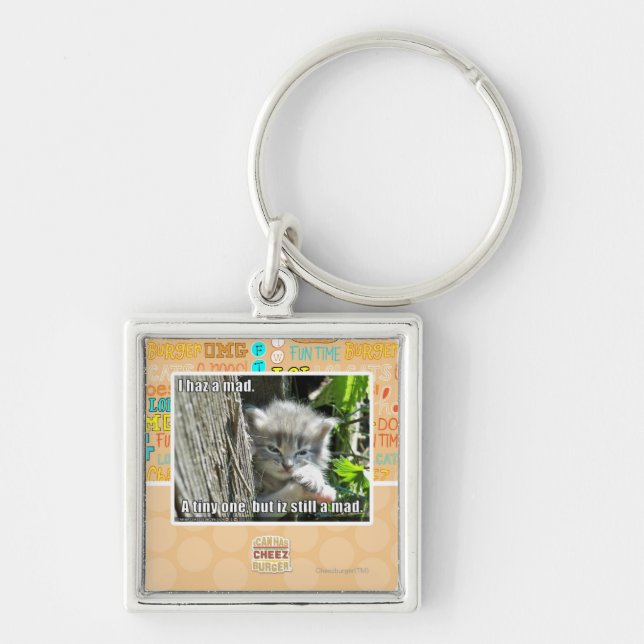 Mig haz ett tokigt fyrkantig silverfärgad nyckelring (Framsidan)