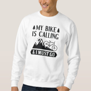 Min bike ringer och jag måste gå. lång ärmad tröja