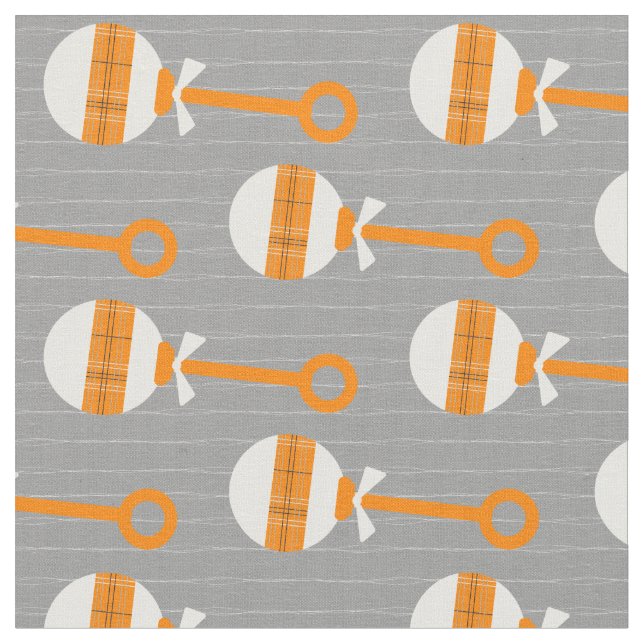 Miners Orange Play Baby Rattle på Grått Tyg (Närbild)