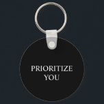 Minimal Prioritize You Quote black colour Nyckelring<br><div class="desc">Keep a meaningful reminder close with this “Prioritize You” minimalist keychain. Designed with clean typography and soft neutral aesthetics, this accessory adds a calm, modern touch to your keys, bags, backpacks, or daily essentials. Perfect for everyday use, gifting, or personal motivation, this keychain blends simplicity with purpose. Whether for work,...</div>