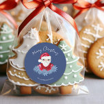 Minimal Santa Cute Poinsettia Blue God jul Runt Klistermärke<br><div class="desc">Denna minimala märkre för "God jul"-helgdag har en hand plockade-vismisk tomte och blek blå poinsettias på en traditionell mörk blått bakgrund som tillför en liten aning nostalgiskt stollig. Originalkonst av Malissa Melrose.</div>