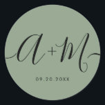 Minimalist Monogram Script Custom green Wedding Runt Klistermärke<br><div class="desc">Elevate your wedding details with the Minimalist Monogram Script Custom Wedding Date green Sticker. This elegant and personalized sticker adds a touch of sophistication to your wedding stationery, allowing you to showcase your monogram and wedding date in a simple yet impactful way. The sticker features a minimalist script design that...</div>