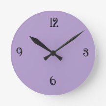 Minimalistisk lila violett rund väggklocka