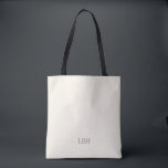 Minimalistisk monogram brudtärna-handväska tygkasse<br><div class="desc">En present de kommer bära överallt – bokstavligen. Denna elfenbensvita handväska med ett rent grått monogram är rymlig nog för brölloppsdagens nödvändigheter och chic nog för vardagliga ärenden. En personlig brudtärna-present som är lika praktisk som den är vacker.</div>