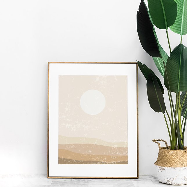 Minimalistisk neutral solnedgångslandskapsväggkons poster (Boho Minimalist Neutral Sunset Wall Art in a copper frame next to a large plant.)