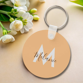 Minimalistisk orange av modern elegant, monogram nyckelring