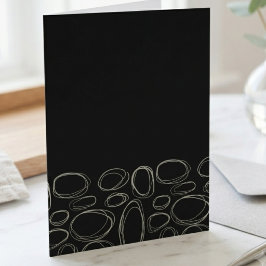 Minimalistiska vita klottercirklar på svart kort