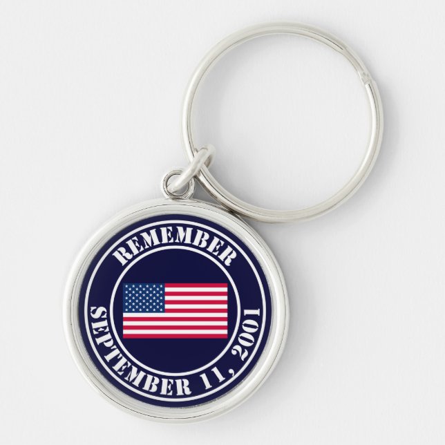 Minns 9/11 rund silverfärgad nyckelring (Framsidan)