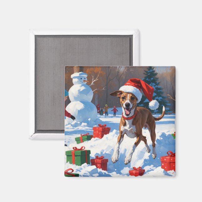Minskoghund springer i snö med julhatt magnet (Front/Back)