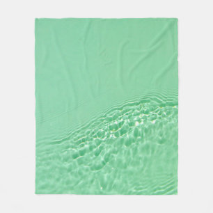 Mint blue färgad bort vatten yta struktur med fleecefilt