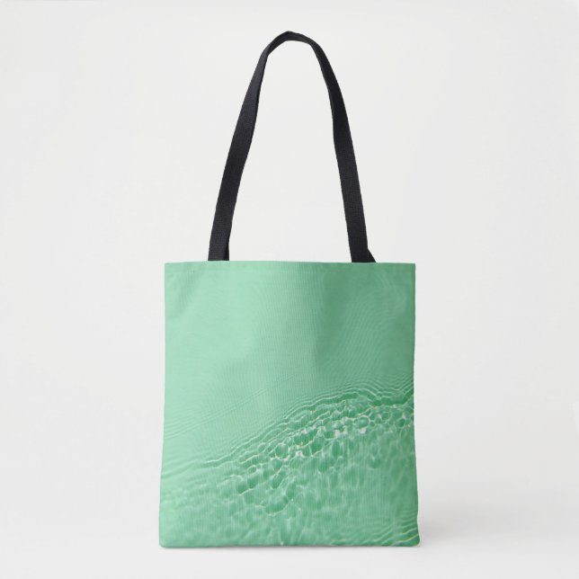 Mint blue färgad bort vatten yta struktur med tygkasse (Framsida)