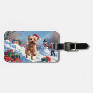 Mjukhårig Wheaten Terrier springer i snö med julha Bagagebricka