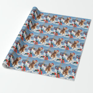 Mjukhårig Wheaten Terrier springer i snö med julha Presentpapper