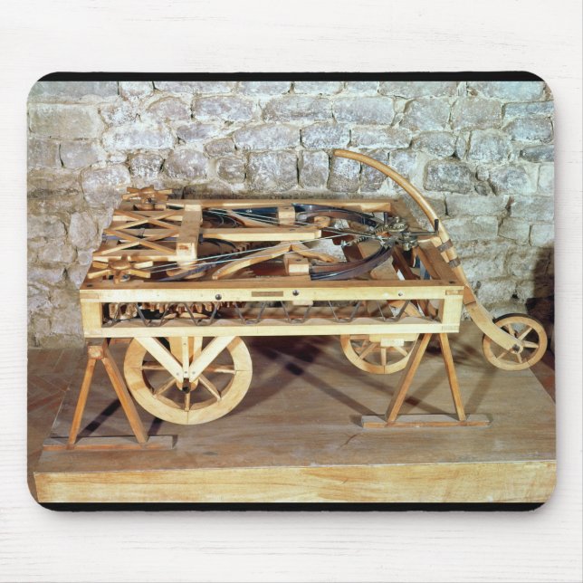 Modellera av en bil som är drivande vid vårar musmatta (Framsidan)