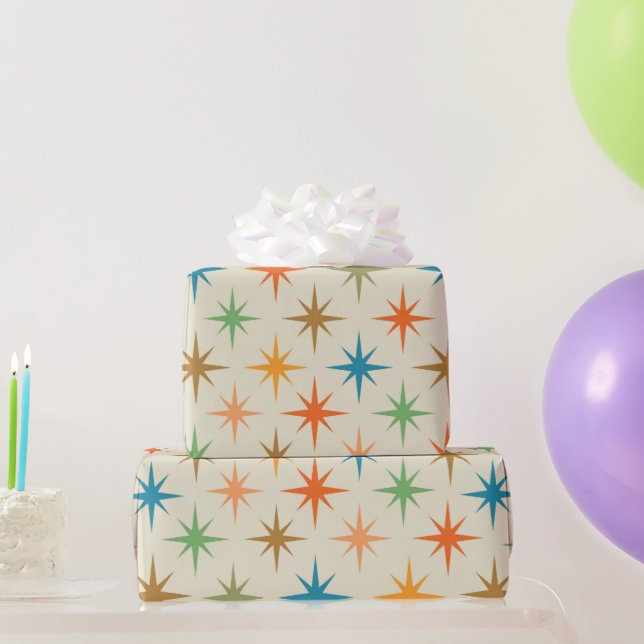 Moderata, färgstarka atomstjärnor i mitten av århu presentpapper (Festgåvor)