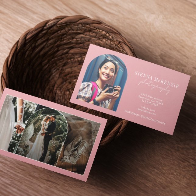 Modern Arch Script Photography Professionell Visitkort (Two business cards in a woven basket on a wooden table. One card shows a smiling woman with a camera)