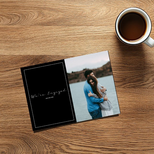 Modern bild och förlovning i lycklig tack kort (We're Engaged photo card with large image and white on black text.)