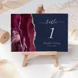 Modern Burgundy Silver Agate Navy Blue Bröllop Bordsnummer<br><div class="desc">Det moderna kortet för bordsnummer i bröllop i elegantens lämnat kant har en burgudisk vattenfärgsagat i gräns som trimmas med faux silver glitter. Med anpassadet kombineras handskrift,  kursiv och mönsterbaserad typsnitt i silver grått mot en marin blå bakgrund.</div>