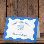 Modern djärv Vågigt Gräns Personlig Blue Hanukkah Kort<br><div class="desc">Skicka ditt varmaste Hanukkah önskemål med de här eleganterna, anpassadets hälsningskort. De här korten har en levande blå bakgrund, en klassisk menorahillustration och en vågigt gräns-design och erbjuder en modern vändning på traditionella Hanukkah-teman. Anpassa till din familj namn för en verkligt speciell beröring, skapar varje kort vara en minnesvärd keepé...</div>