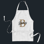 Modern Elegant Monogram Namn Black Guld Förkläde<br><div class="desc">Den moderna Eleganten Monogram Namn Black Guld-Vuxen Apron ljud liknar ett sofistikerat och snyggt som tillfogas till vilket kök eller arbetsyta som helst. Den här plattan kan ha en klassisk svart bas med skript för elegant guld för monogrammet och namn, vilket ger en lyxande och personlig beröring. Det är perfekt...</div>