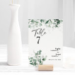 Modern Greenery White Bröllop Bordsnummer Card<br><div class="desc">Den här moderna gröna vita bordsnumret-kortdesignen i bröllop har en enkel blandning och matchar koordineringen av stilar i svartvitt med delikat grönt inslag som tillför en skarp blomning kring enkel sofistikerad typografi och ett vackert kalligrafiskt skript. Vattenfärgen eukalyptus och andra botaniska löv är vackert genomgående, med mörk emerald bleknande i...</div>