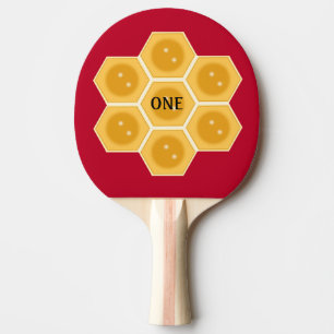 Modern honungskaka på burgunderröd pingisracket