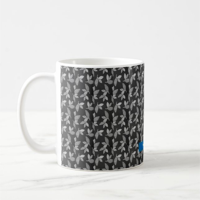 Modern löv-design i svart kaffemugg (Vänster)