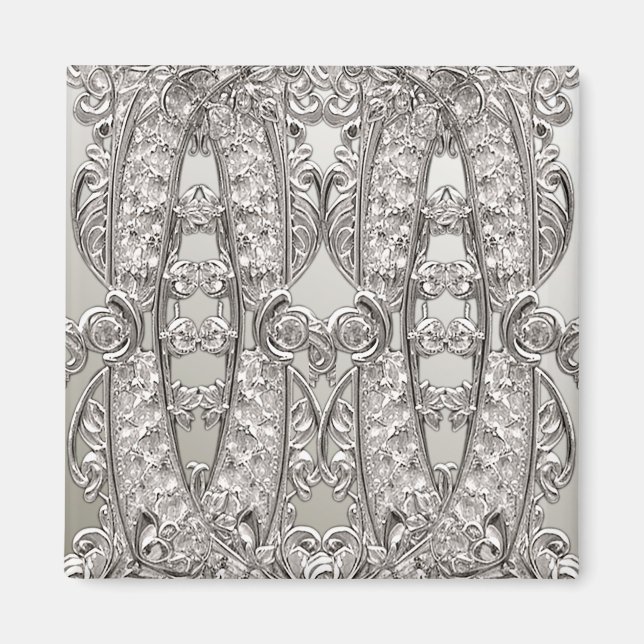 Modern magnet i silver med utsirad ornamentik (Framsidan)