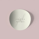 Modern Minimal Elegant Script Monogram Wedding Runt Klistermärke<br><div class="desc">Modern Minimal Elegant Script Monogram Wedding Classic Round Sticker Add a touch of elegance to your wedding with these modern, minimalist, and elegant script monogram classic round stickers. Crafted in classic ivory and storm dust colors, these stickers are perfect for sealing invitations, favor bags, or adding a personalized touch to...</div>