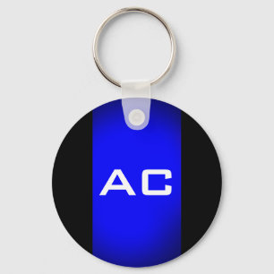 Modern svart svart monogram-slinga nyckelring
