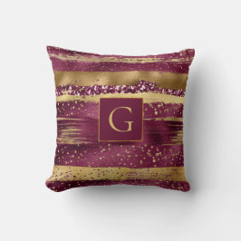 Moderna burgundi, guld-penseldrag och monogram kudde