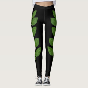 Moderna gröna lagerblad på svart leggings