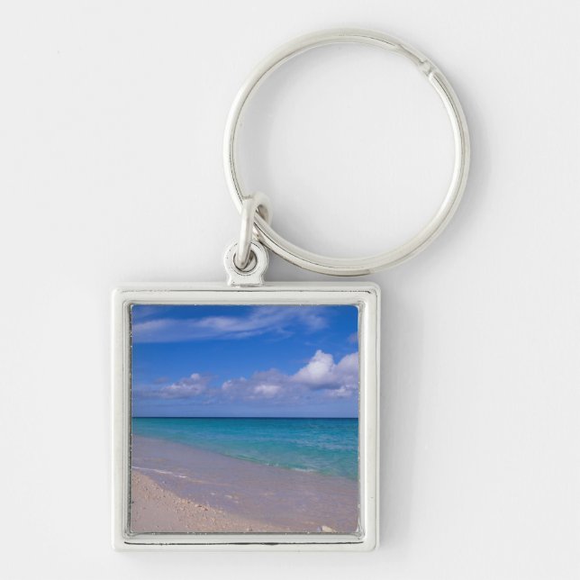 Moln i blå himmel över sandig strand fyrkantig silverfärgad nyckelring (Framsidan)