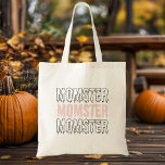 Momster Rosa Halloween Cute & Spooky!" Tygkasse<br><div class="desc">Bär dina Halloween-essentialer i stil med vår "Momster" Rosa Halloween Tote Bag! Perfekt för mammor, som kärlek som vill ta till sig spookysäsongen med en liten bit humor, har den här totepåsen en lekfull "Momster"-design i fet, spooky-text på en sjudande bakgrund på rosan. Vare sig du trillar eller behandlar med...</div>
