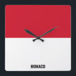 Monaco Flagga Dazzling Patriotic Fyrkantig Klocka<br><div class="desc">Monaco Flagga Dazzling Patriotic Square Wall Clock i färg och inslag i Monaco-flagga som täcker framsidan av klockan. Flagga kompletteras med texten "Monaco" på grund. Anpassadet Text är fullt ut med funktionen "Anpassa den!". Du kan ändra den, ta bort den eller lägga till en egen. Den här charmerande utformningen är...</div>