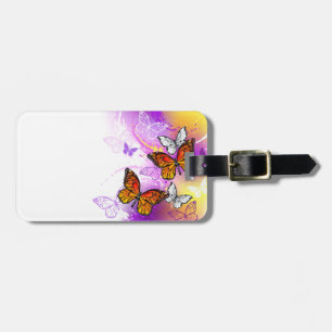 Monarch Butterflies on Lila Background Bagagebricka